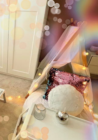 Teepee setup for a pamper party, featuring pastel decor, plush cushions, and spa-themed accessories.