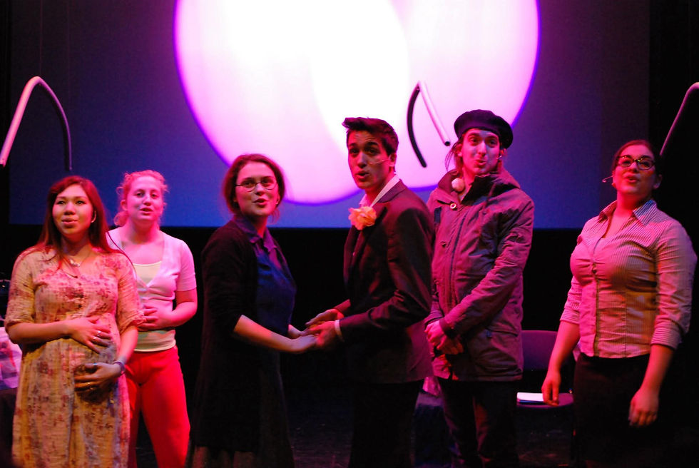 cast singing on-stage to a young audience