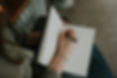 Melissa taking notes in her to-do list journal