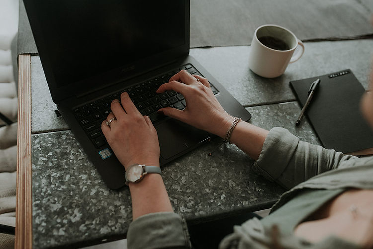 Melissa typing on her laptop keyboard