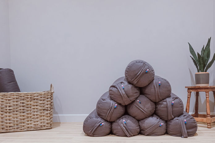 Yoga bolsters stacked up ready for class to begin