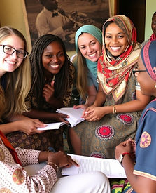 American college students participating in cultural exchange activities in Kenya, engaging