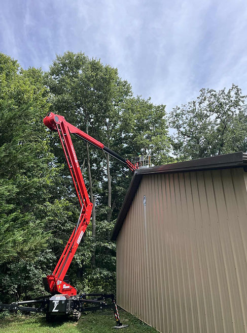 Antrim TreeService pruning multiple trees over a garage structure in Greencastle PA