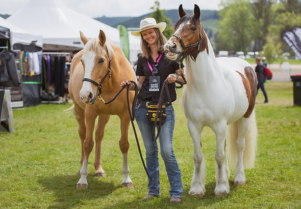 Bex Tasker, founder of Positively Together training business, with her horses at an event in NZ