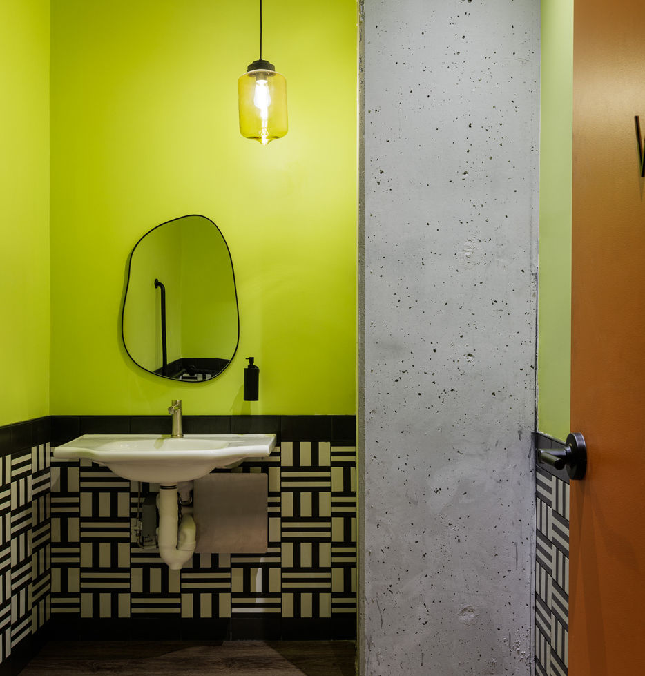 Bright_Green_Restaurant_Bathroom_With_Italian_Black_And_White_Wall_Tile