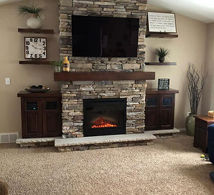 Orange City, IA Stone Fireplace, Floating Shelves, And Cabinets.jpg