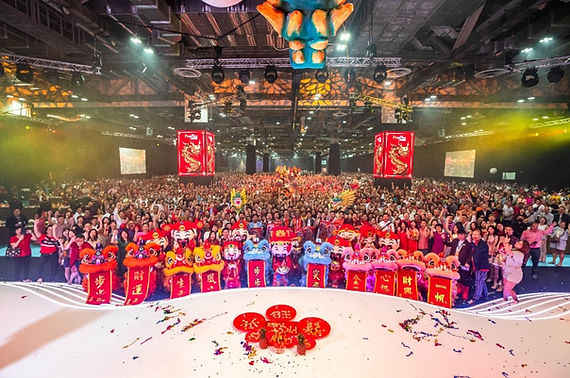 Participants of Lo Hei salad toss