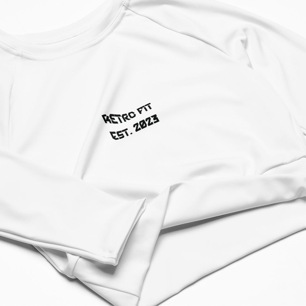 Close-up view of White long-sleeve cropped sweatshirt with "RETRO FIT" and "EST. 2023" printed on the left chest.