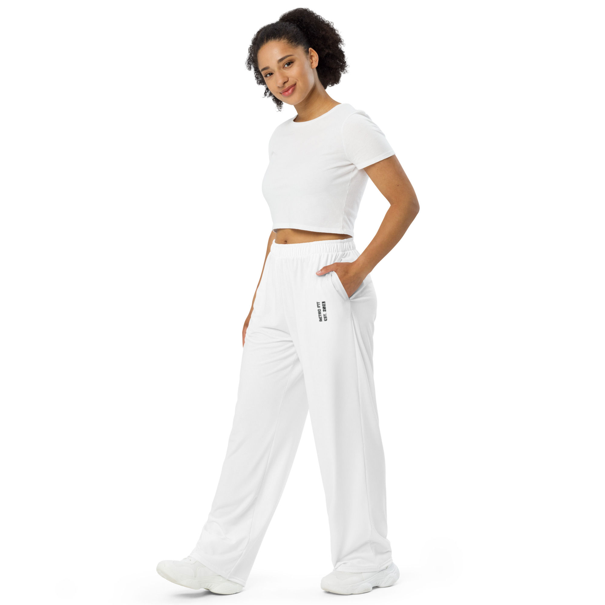 Side view of a Essential Wide-Leg Pants. The hat features black embroidered text reading "RETRO FIT EST. 2023."