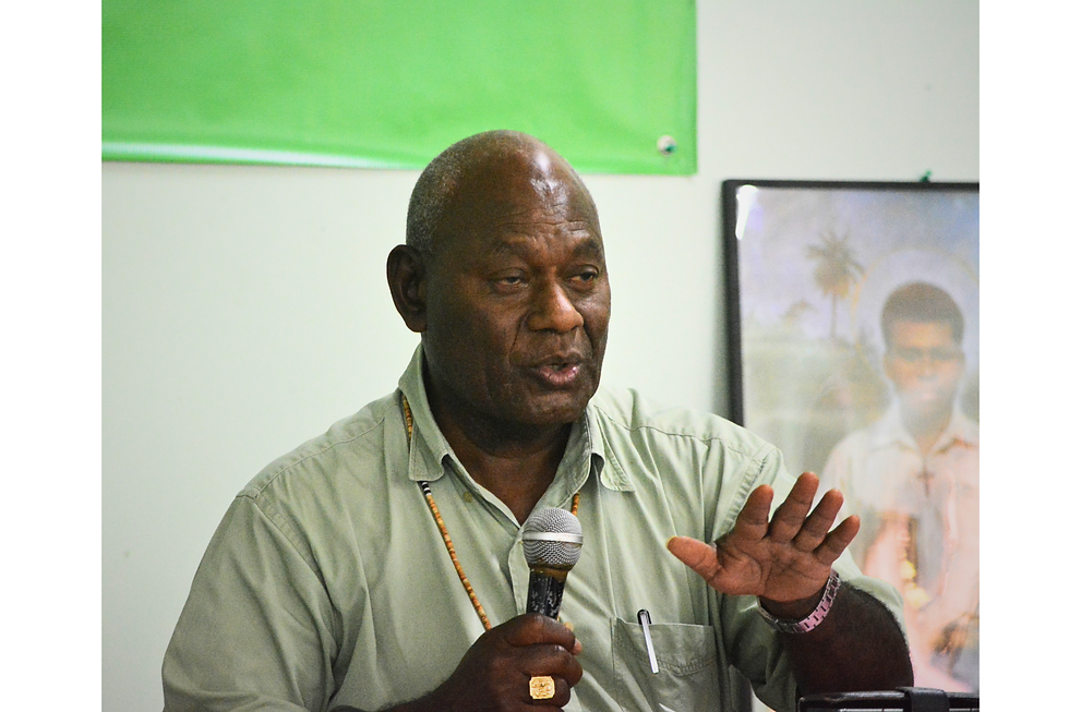 His Eminence Sir John Cardinal Ribat addressing the media