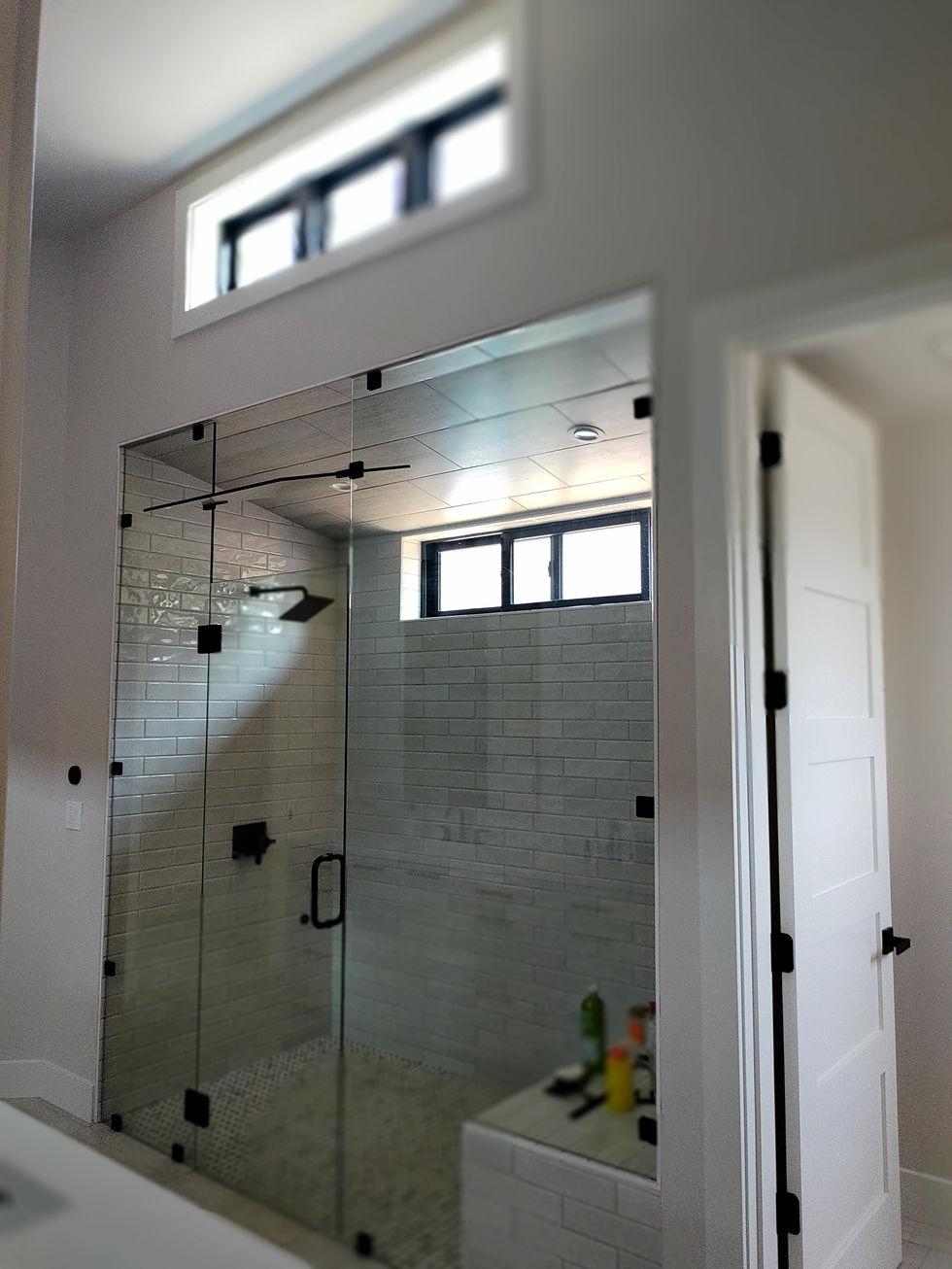 Frameless glass shower enclosure with modern design