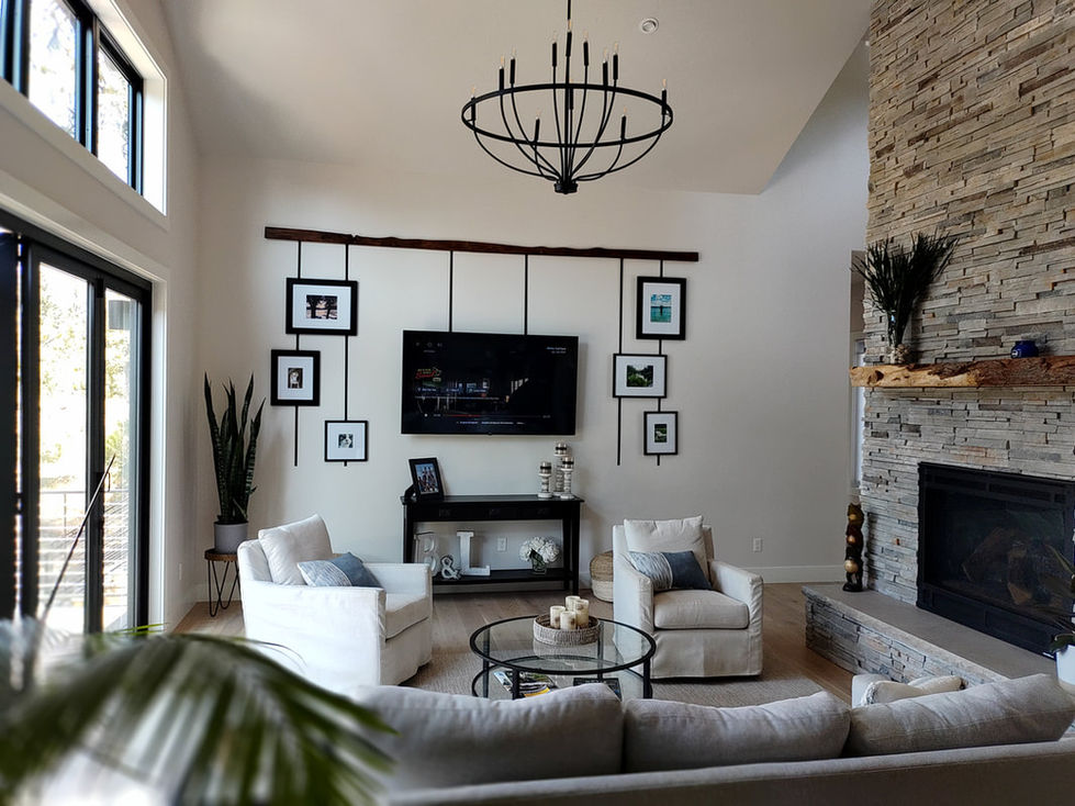 Modern living room with stone fireplace, and stylish decor