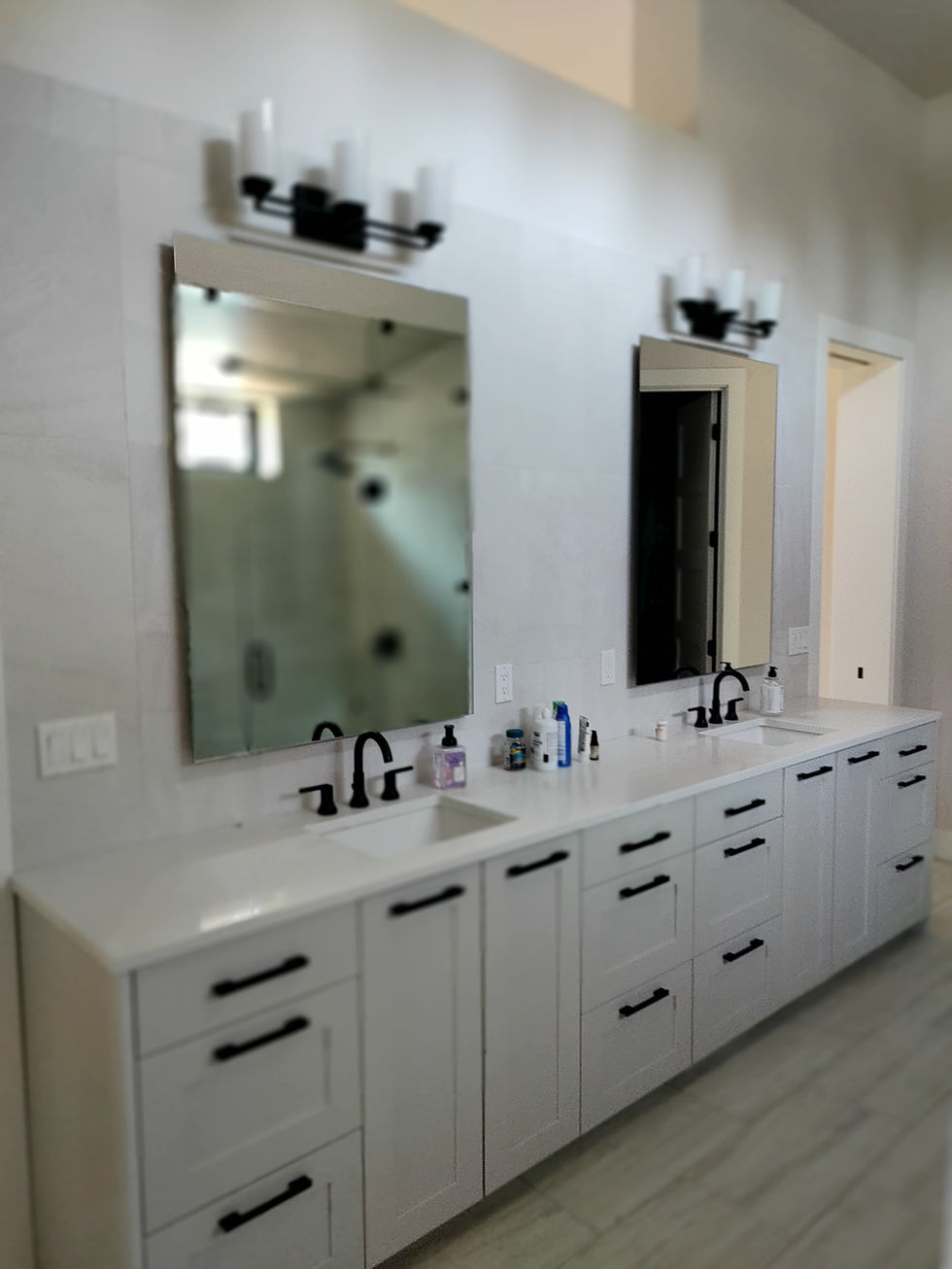 Modern double vanity bathroom with black fixtures