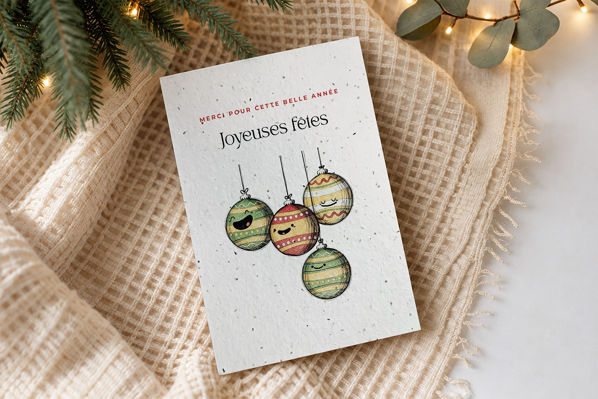 Chorale, carte de Noël à semer personnalisable posée sur un tricot, entre sapin et lumières, fait main au Québec