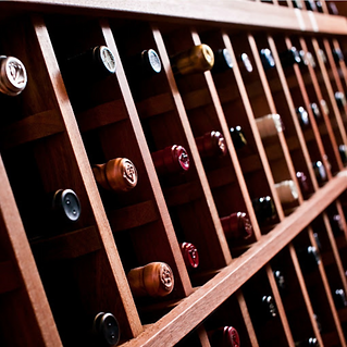 A close up image of a custom wooden wine cellar.