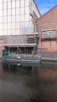 Bick Construction workers, working on a canal-side scaffolding in Birmingham