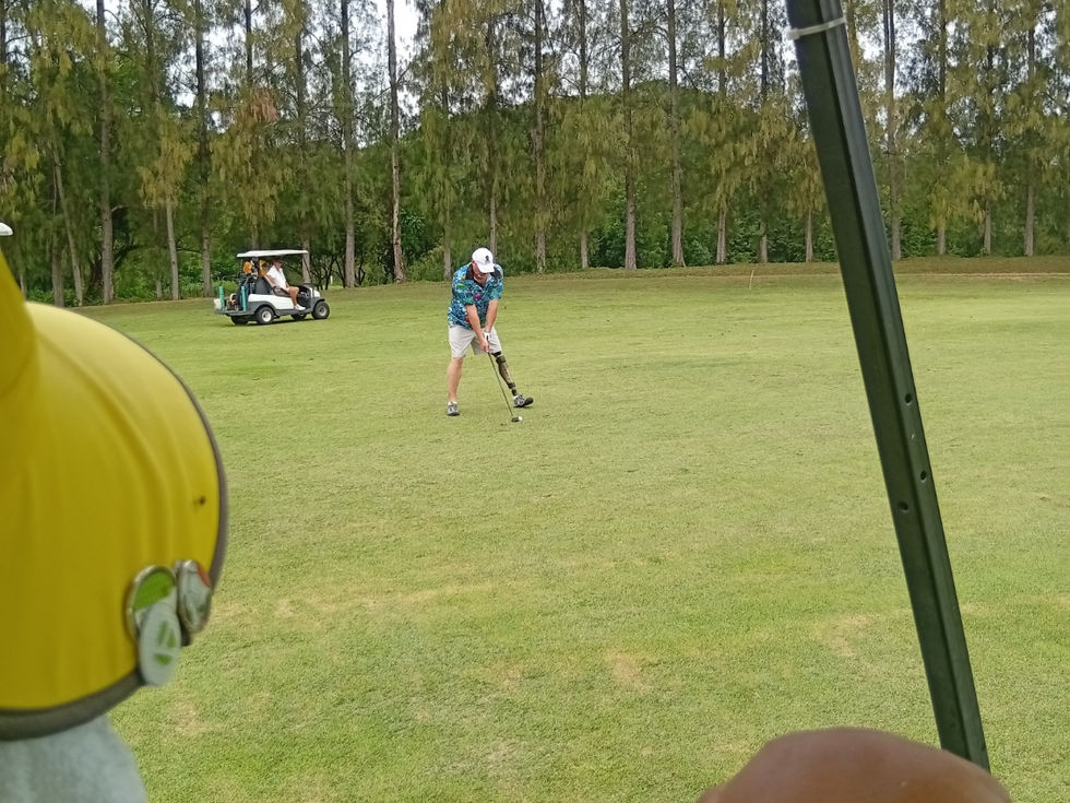 Golfer swinging club at Mida Golf Course Resort