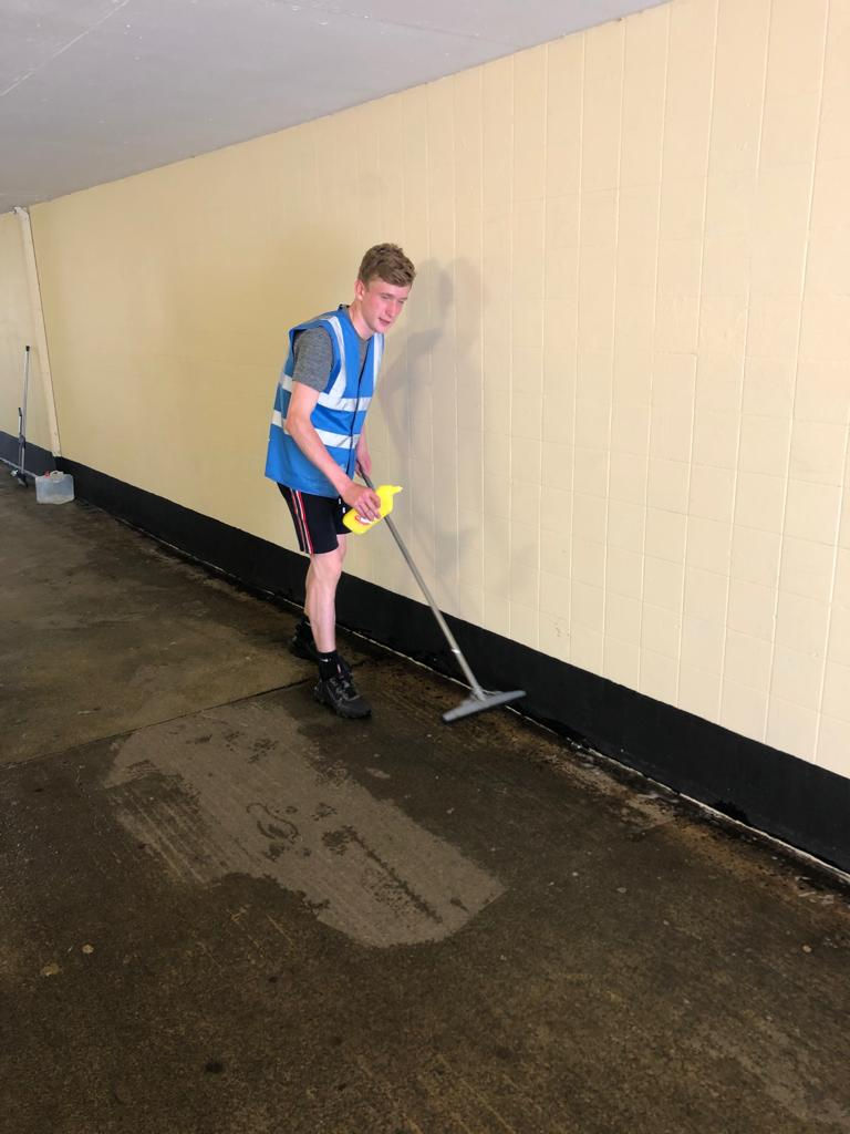 Matthew cleaning the underpass
