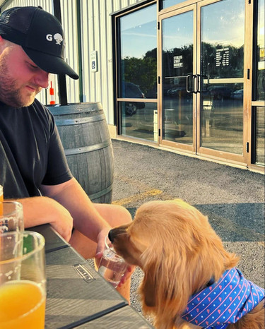 Man at Sterling Street Brewery with dog