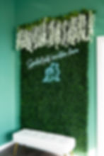 Grass wall decor with neon pet sign