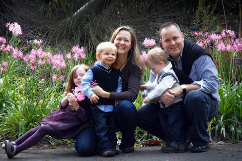 family in blues and blacks for portrait shoot with holman photography