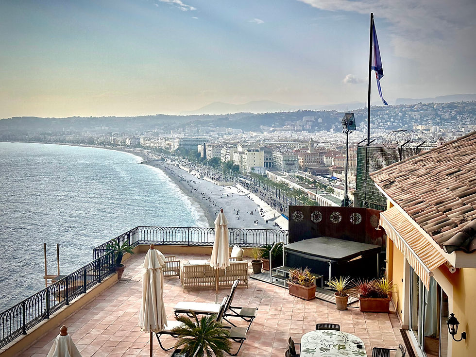 View of hotel Pérouse suite deck and the Nice beaches and rooftops beyond