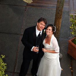 couple smiles up at photographer at intimate napa wedding