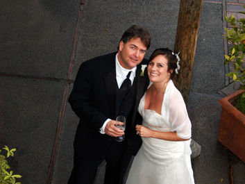 couple smiles up at photographer at intimate napa wedding