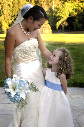 bride looks down at flower girl at berkely wedding