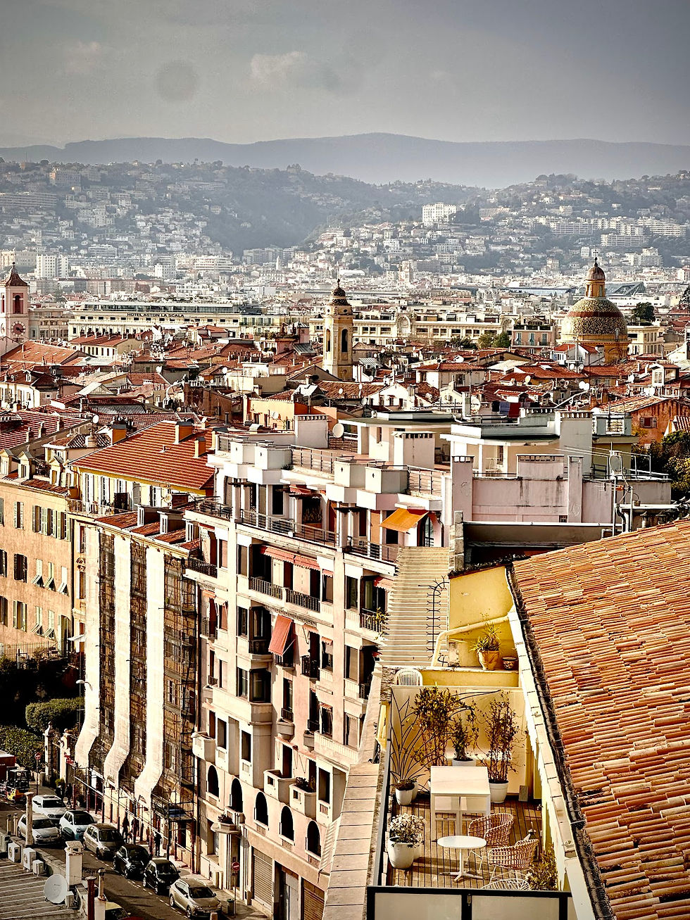 Nice buildings and architecture from the Castle Hill with mountains behind