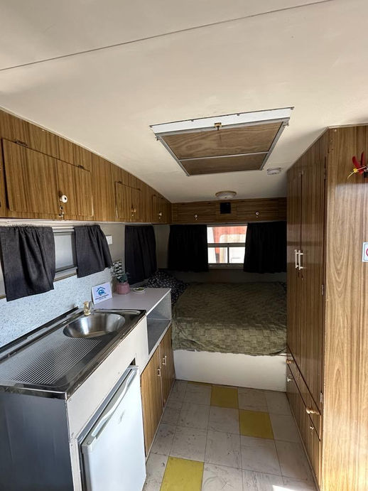 Compact caravan kitchen and dining area