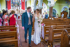 Bride and groom exit from the church