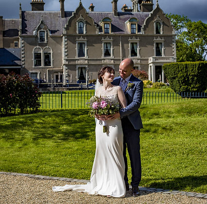 Bride and groom taking photographs at Killashee Hotel