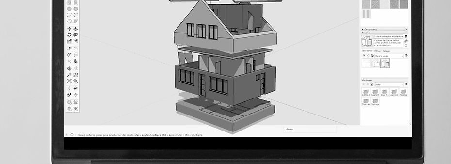 un ordinateur dans un atelier de menuiserie avec des plans d'un meuble réalisé sur SketchUp