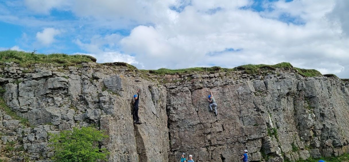 Family enjoying rock climbing in the Lake District
