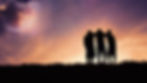 Three silhouettes stand together, arms around each other, against a colorful sunset sky with a planet and shooting star. Peaceful mood.