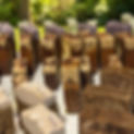 Artisan soap bars with textured tops, natural colors, displayed outdoors.