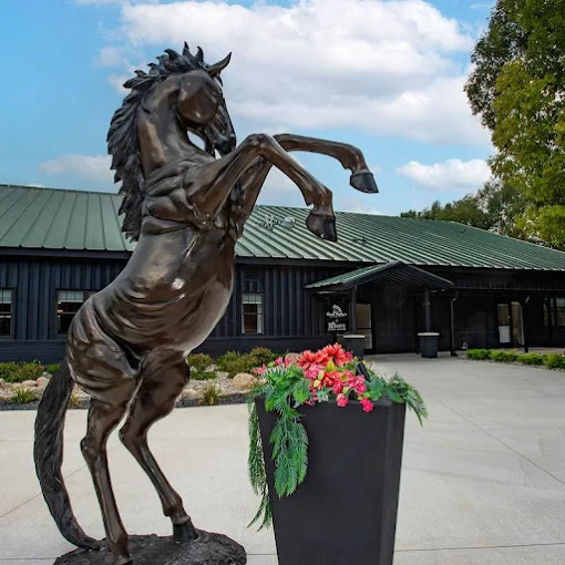 Front exterior of Horse Feathers restaurant in downtown Pinckney, MI, a popular local dining spot.