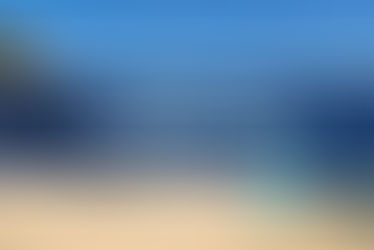 Sleeping Bear Dunes National Lakeshore with golden sand dunes along Lake Michigan under a bright blue sky – highlighting why many ask, “Is Michigan a good place to live?” - thumbnail