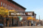 Historic downtown Howell, Michigan with local storefronts along Grand River Avenue reflecting small-town charm