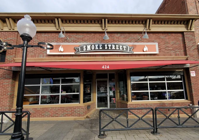 Front entrance of Smoke Street BBQ restaurant in downtown Milford, MI