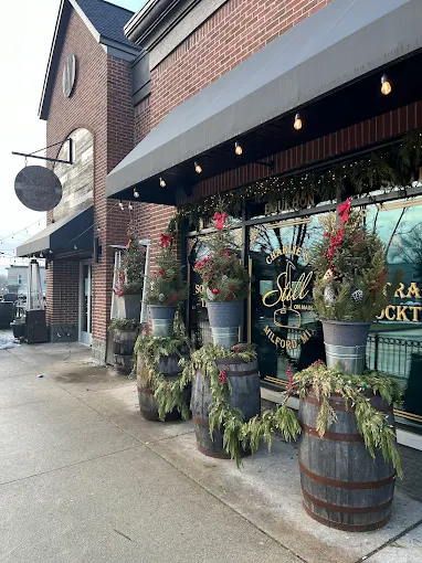 Historic-style exterior of Charlie’s Still on Main restaurant in Milford, MI