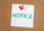 Rental increase notice pinned to tenant notice board – property management communication