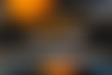 Pumpkins and a rustic wooden sign that reads "Trick or Treat" on a porch for Halloween decor - thumbnail