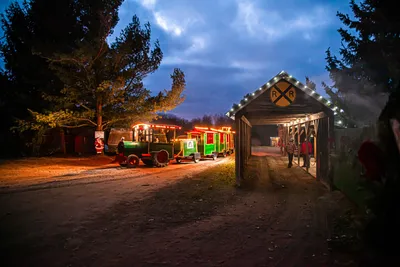 Vintage holiday train and festive train station at Peacock Road Family Farm, ready to take families on a magical ride to visit Santa.