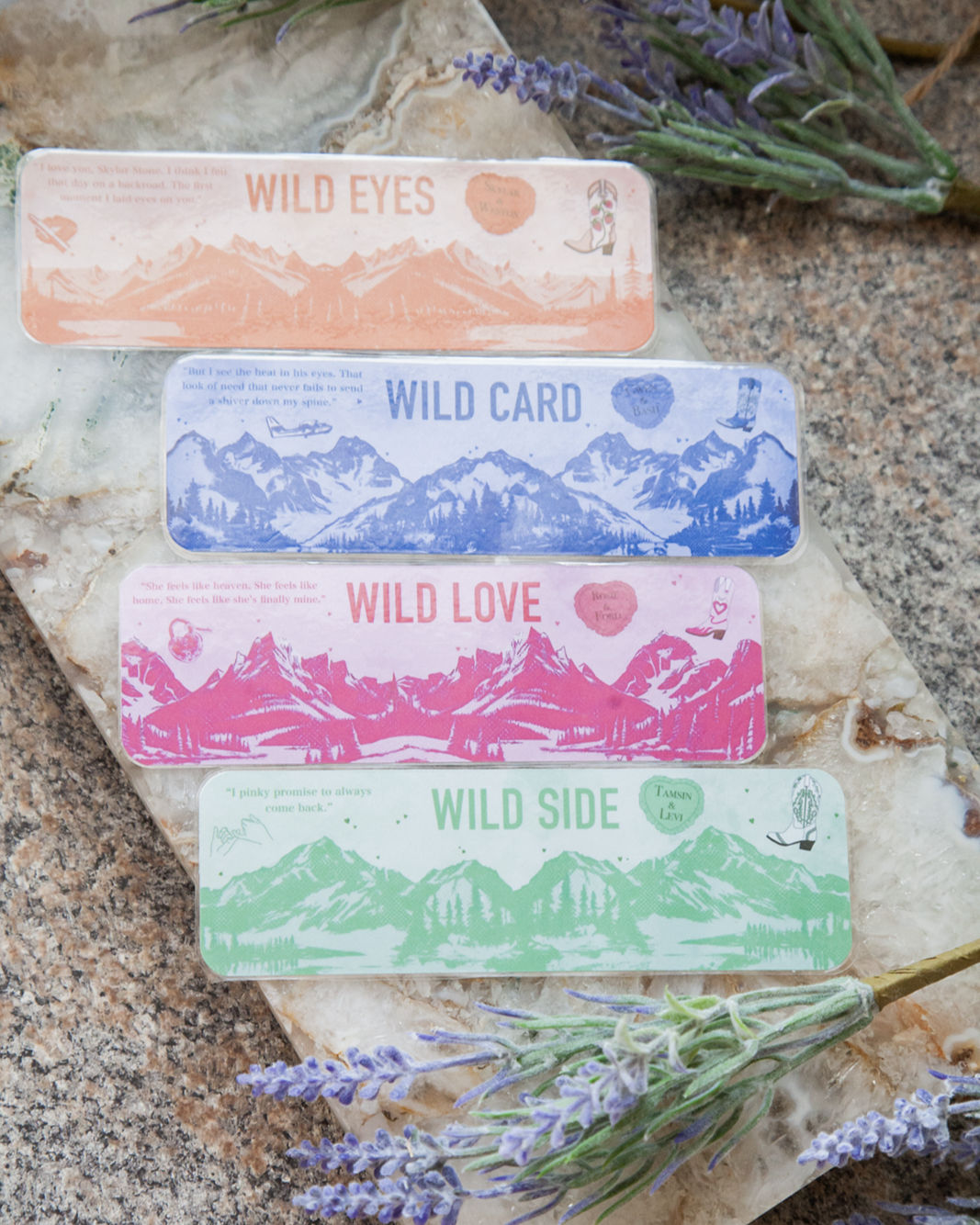 A collection of four bookmarks, one pink, one green, one orange, and one purple showing the title of each book in the rose hi