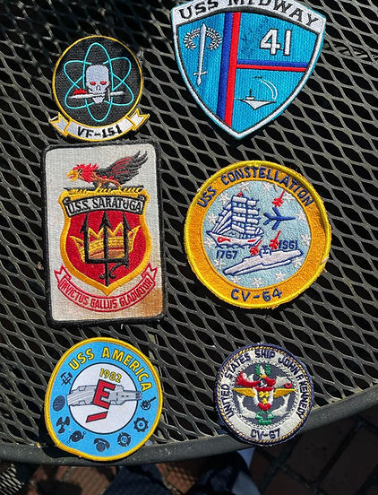 Sew on patches for several retired US aircraft carriers