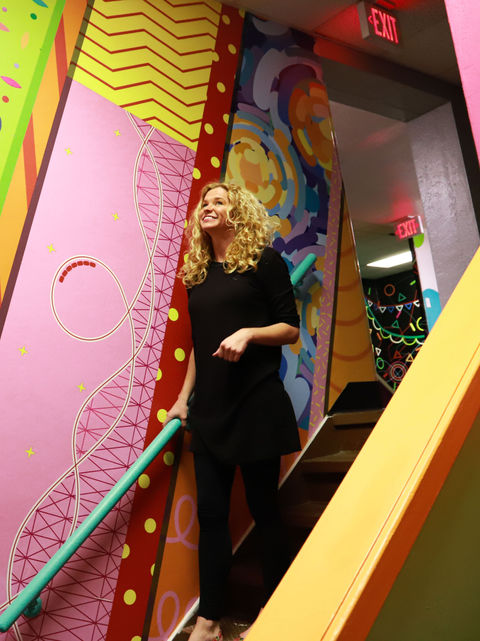 Colorful vinyl mural installation throughout Immanuel Church hallways and staircases, designed to create an immersive and engaging environment with playful graphics that connect across the space.
