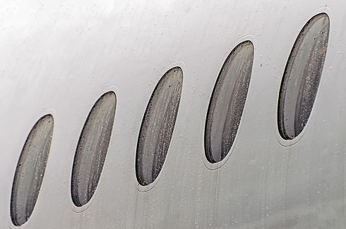 porthole-windows-of-an-airplane-wet-weat