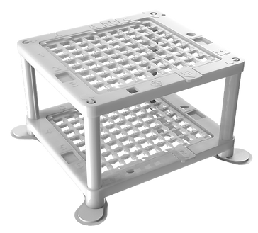 The Access Cube, a single-use, sterile medical device used for planning CT-navigated interventions. A white cube with two layers, each containing an alphanumeric grid serving as coordinates for needle introduction.